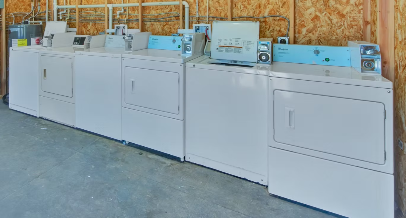 Coin-operated washers and dryers in the laundry room