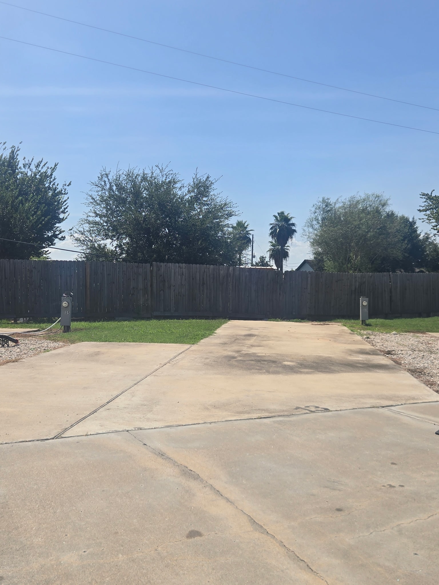 RV site with privacy fence and concrete pad